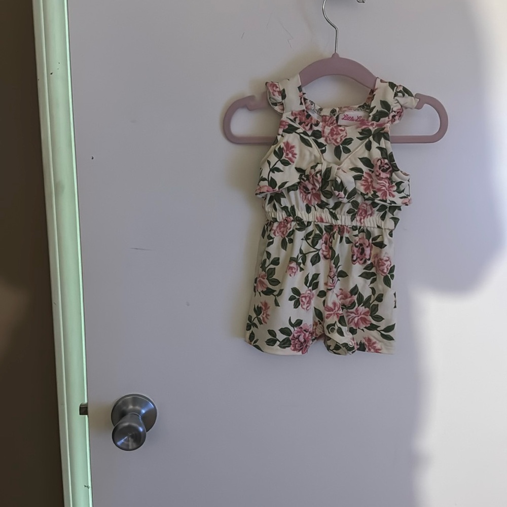 Flower romper elastic waist . button in back
